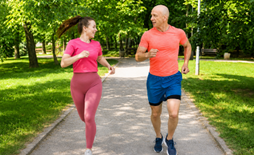 How to Find Motivation for Healthy Habits Man and woman running in a green park, showing how to find motivation for healthy habits