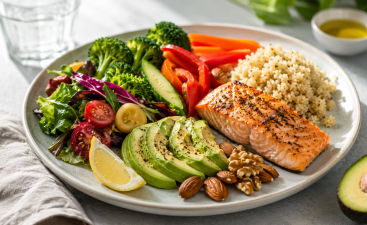 Balanced Diet Healthy Plate with Salmon, Avocado, Vegetables, and Quinoa Nutrition and healthy eating with fresh avocado and vegetables