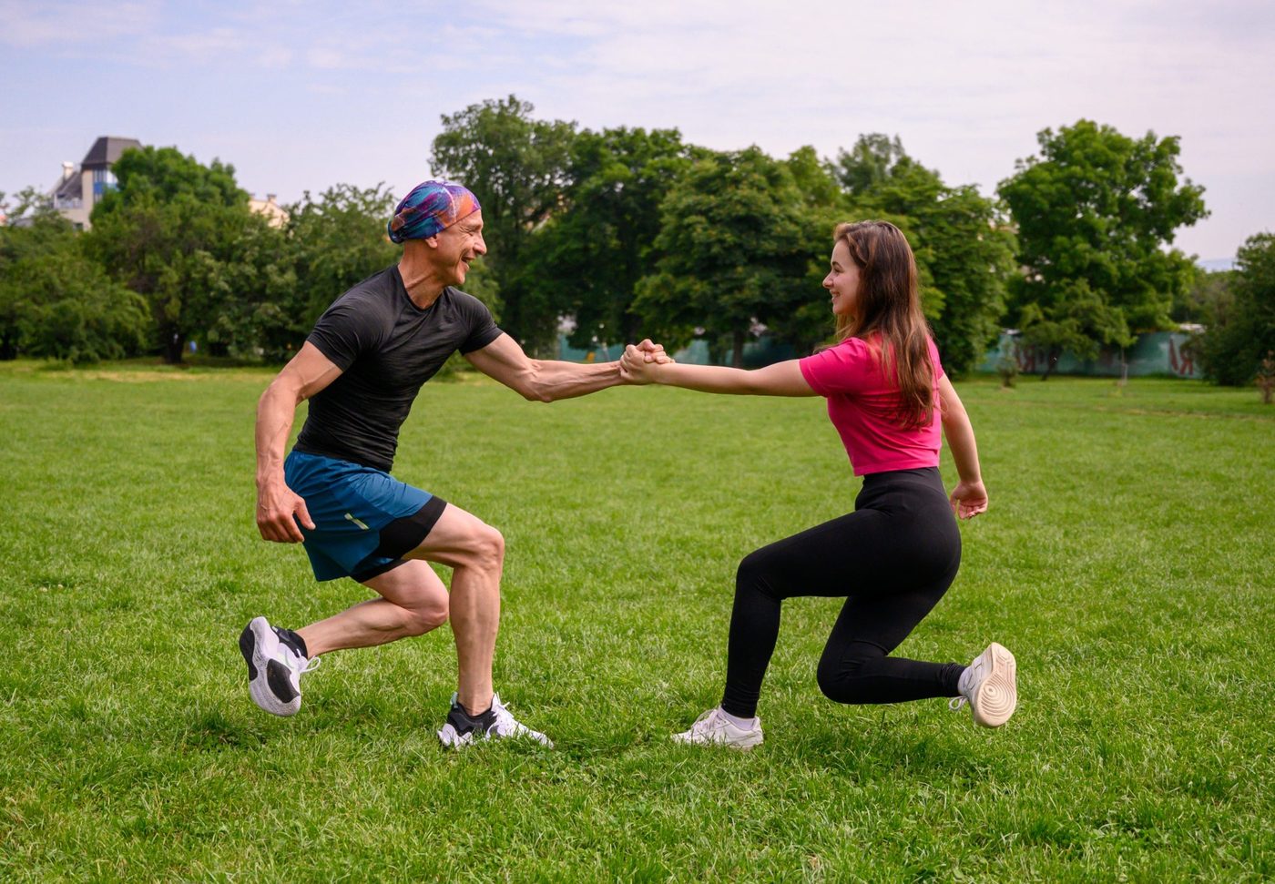 Father and daughter doing a live bodyweight workout outdoors